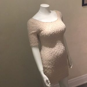 Apricot bodycon dress.